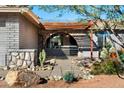 Front entry with stone accents and a charming walkway at 1720 E Intrepid Ave, Mesa, AZ 85204