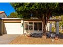House exterior with garage and mature tree at 178 Leisure World --, Mesa, AZ 85206