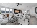 Spacious living room with L-shaped sofa, modern coffee table, and open floor plan at 2330 N 28Th Pl, Phoenix, AZ 85008