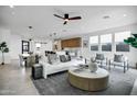 Open concept living area with modern furniture and large windows at 2336 N 28Th Pl, Phoenix, AZ 85008