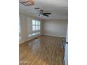 Bright and airy living room with laminate flooring and window shutters at 2650 W Union Hills Dr # 33, Phoenix, AZ 85027