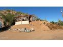 Hillside home with wooden pergola and desert landscape at 2960 W Tonto St, Apache Junction, AZ 85120