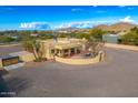 Aerial view of a sprawling property with a large house and ample parking at 37415 N 24Th St, Phoenix, AZ 85086