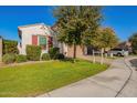 Two-story home with a two-car garage and nicely landscaped front yard at 918 W Yellowstone Way, Chandler, AZ 85248