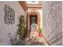 Elegant entryway with arched doorway, tile accents, and a charming walkway at 918 W Yellowstone Way, Chandler, AZ 85248