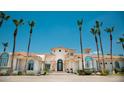 Stunning exterior of a large estate home with palm trees at 10754 E Laurel Ln, Scottsdale, AZ 85259