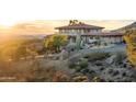 Stunning home exterior with mountain views and a long driveway at 11426 E Cottontail Rd, Cave Creek, AZ 85331