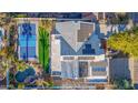 Aerial view of a home with solar panels and a pool at 12528 N 78Th St, Scottsdale, AZ 85260