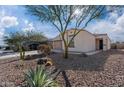 Single-story house with desert landscaping and two-car garage at 12657 W Myrtle Ave, Glendale, AZ 85307