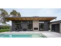 Mid-century modern home with pool and expansive patio at 1442 E Rancho Dr, Phoenix, AZ 85014