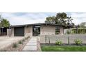 Modern home with landscaped yard and walkway at 1442 E Rancho Dr, Phoenix, AZ 85014