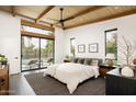 Spacious bedroom with large windows and private access to the pool at 1442 E Rancho Dr, Phoenix, AZ 85014
