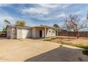 Large backyard with covered patio and spacious concrete area at 14846 N 29Th Ave, Phoenix, AZ 85053