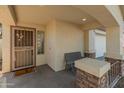 Front entry with security door and a welcoming bench at 2403 W Via Dona Rd, Phoenix, AZ 85085