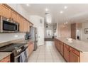 Modern kitchen features stainless steel appliances and an island at 29433 N 155Th Ave, Surprise, AZ 85387