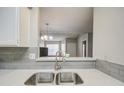 Clean kitchen sink with a view into the living room at 4608 W Maryland Ave # 127, Glendale, AZ 85301