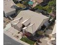 Aerial view of a house with a large backyard, pool, and attached garage at 758 S Lagoon Dr, Gilbert, AZ 85233