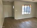 Bright living room featuring neutral walls and updated flooring at 10220 N 36Th N Ave, Phoenix, AZ 85051