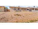 Large front yard with dirt and sparse vegetation at 11624 N 25Th Ave, Phoenix, AZ 85029