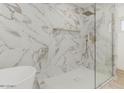 Spa-like bathroom with marble shower and soaking tub at 126 E Northern Ave, Phoenix, AZ 85020