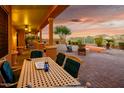 Spacious patio with seating area, providing ample space for outdoor dining and relaxation at 12963 S 183Rd Ave, Goodyear, AZ 85338