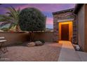 Brick paved courtyard with a seating area; inviting entry at 13036 W Fetlock Trl, Peoria, AZ 85383