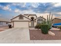 Desert landscape surrounds this charming one-story home with a two-car garage at 18807 N 2Nd Ave, Phoenix, AZ 85027