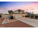 Well-maintained home with a two-car garage and landscaped yard at 18807 N 2Nd Ave, Phoenix, AZ 85027