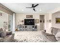 Spacious living room with a gray sectional and built-in entertainment center at 19202 W Coolidge St, Litchfield Park, AZ 85340