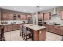 Eat-in kitchen with granite countertops and ample cabinet space at 20562 E Raven Dr, Queen Creek, AZ 85142