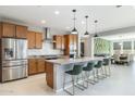 Modern kitchen with granite countertops and stainless steel appliances at 27165 N 71St Ln, Peoria, AZ 85383
