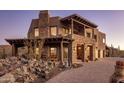 Mountain contemporary home with stone accents and covered patio at 37300 N School House Rd, Cave Creek, AZ 85331