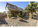 Beautiful two-story home showcasing desert landscaping and a spacious, shaded front porch at 4615 W Corral Rd, Laveen, AZ 85339