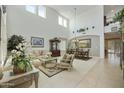 Bright and airy living room boasts soaring ceilings, clerestory windows and elegant furnishings at 4615 W Corral Rd, Laveen, AZ 85339