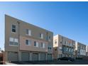 Rear view of townhouses showing parking and building details at 706 E Washington St # 128, Phoenix, AZ 85034