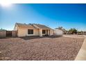 Single-story house with rock landscaping and a driveway at 7137 W Mercer Ln, Peoria, AZ 85345