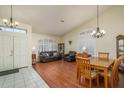 Bright dining area with hardwood floors and a wood table at 11503 W Cyprus Dr, Avondale, AZ 85392