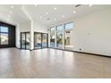 Spacious living room with tile floors and large windows at 11850 E Del Timbre Dr, Scottsdale, AZ 85259