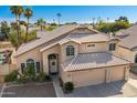 Two-story house with a three-car garage and landscaped yard at 1231 N Layman St, Gilbert, AZ 85233