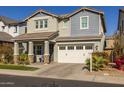 Two-story home with white garage doors and landscaping at 1336 E Sierra Vista Dr, Phoenix, AZ 85014