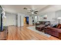 Living room features hardwood floors and an open concept at 15742 W Watson W Ln, Surprise, AZ 85379