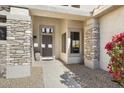 Front entry with stone pillars and a path at 16310 W Boulder Dr, Surprise, AZ 85374