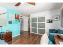 Serene bedroom with light teal walls and built-in closet at 1643 W Harmont Dr, Phoenix, AZ 85021