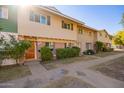 Condo complex showcasing a charming tan building with green accents at 1682 W Campbell Ave, Phoenix, AZ 85015