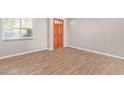 Spacious living room with wood-look tile flooring at 1682 W Campbell Ave, Phoenix, AZ 85015