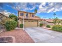 Two-story house with a landscaped yard and attached garage at 17009 S 30Th Way, Phoenix, AZ 85048