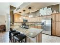 Modern kitchen with granite countertops and stainless steel appliances at 17129 N Silver Path, Surprise, AZ 85374