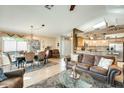 Spacious living room with a leather couch and dining area at 17129 N Silver Path, Surprise, AZ 85374