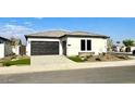 Modern single-story house with attached garage at 17380 W Carlisle Dr, Surprise, AZ 85388