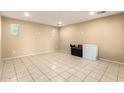 Empty basement room with tiled floors at 1940 N 78Th Gln, Phoenix, AZ 85035